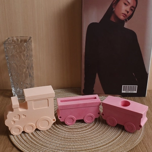 Detailed view of 3-piece train silicone mold set for DIY candles and plaster crafts