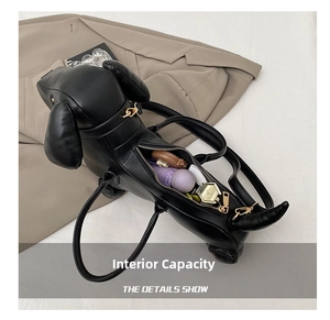 Internal view of sausage dog handbag showing capacity for cosmetics and small umbrella