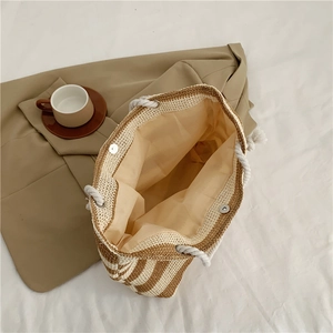 Large capacity striped woven straw shoulder bag with rope handles and magnetic closure