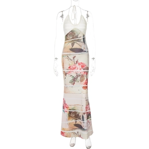 Detail of elegant halter neck maxi dress with white knit bodice and rose print skirt