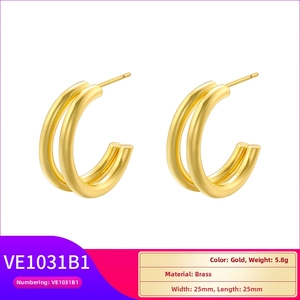 Detail view of gold-plated brass double-hoop C-shaped earrings with size and weight info