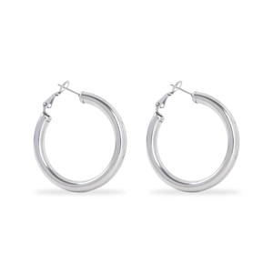 Macro detail of silver geometric circular earrings with a polished metallic finish