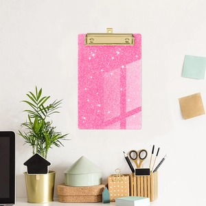 Pink glitter acrylic clipboard with golden metal clip for office and school stationery