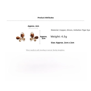 Détails et dimensions des boucles d'oreilles papillon vintage en pierre œil de tigre