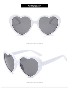 Front and side 45-degree view of white heart-shaped sunglasses with dark lenses