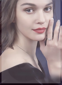Close-up of sparkling heart-shaped zircon ring and bracelet worn by a fashion model