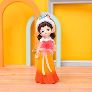 Close-up of Tang-style girl figurine in yellow gradient dress with a pink butterfly