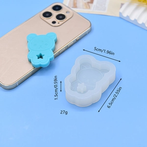Detailed bear-shaped silicone mold and blue resin craft with starry heart detail