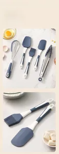 Detail view of 5-piece silicone kitchen utensil set on marble background with ingredients