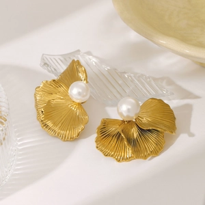 Vintage oversized gold flower earrings with large white pearls and delicate textures