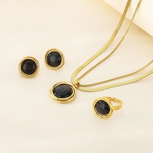 Three-piece gold titanium jewelry set with round black gems including necklace, studs, and ring