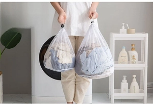 Detail of drawstring laundry bag showing fine and coarse mesh for washing machines