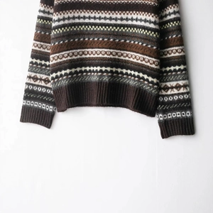 Classic Fair Isle jacquard knit sweater featuring brown geometric patterns and ribbed cuffs