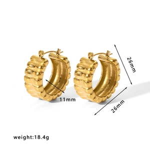 Detailed view of segmented textured gold hoop earrings with 26mm diameter and weight info