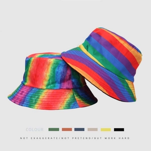 Reversible rainbow bucket hat set featuring tie-dye and striped patterns for sun protection
