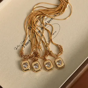 Double-layered gold snake chain necklace with heart zircon square pendant set
