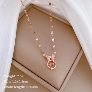 Rose gold bunny pendant necklace with cubic zirconia details on a jewelry box