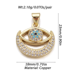 Detailed view of gold evil eye and crescent pendant with size and weight specs