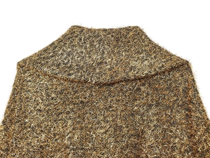 Detail of bomber jacket collar showing black fabric with woven metallic gold threads