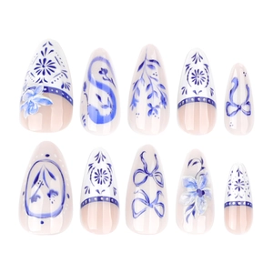 Blue and white porcelain style almond press-on nails with 3D floral and bow designs