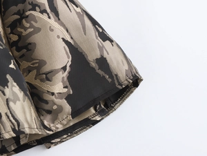 Macro shot of black and gold jacquard fabric with elegant floral textures and stitching