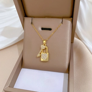 Elegant gold titanium steel necklace with sparkling heart lock and key pendant in box