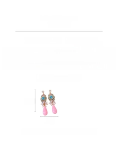 Detailed view of vintage teardrop earrings with pink glass pendants and zircon insets