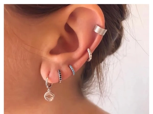 Close-up of model wearing S925 silver hoop earrings with star charm and colorful zircon gems