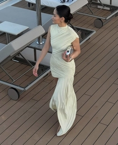 Dynamic view of pale yellow sleeveless bodycon dress with elegant ruched fabric details