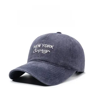 Detail of vintage washed denim baseball cap with New York Campaign white embroidery