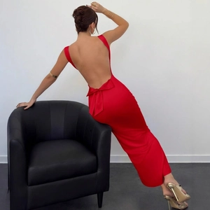 Elegant red satin backless gown featuring a large bow detail on the lower back