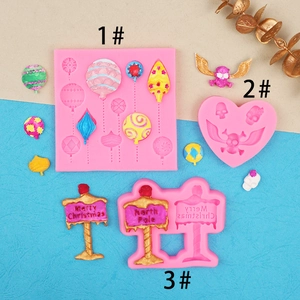 Pink silicone fondant mold set featuring balloons, skulls, and Christmas road signs
