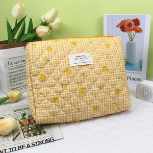 Quilted cotton makeup bag in yellow plaid with lemon print and fabric label