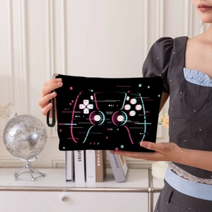 Portable gamer makeup bag with neon controller print and convenient hand strap