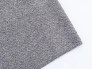 Macro detail showing high-quality medium gray knitted fabric and neat finished edges