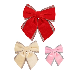 Glitter velvet Christmas bows in red, beige and pink for festive holiday tree decoration