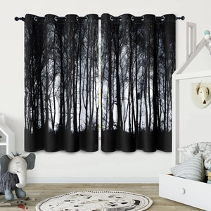 Detail of blackout curtains with black and white forest silhouette in a nursery room