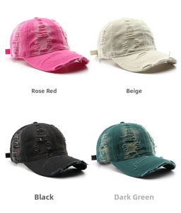 Detailed view of distressed vintage baseball caps in rose, beige, black, and dark green