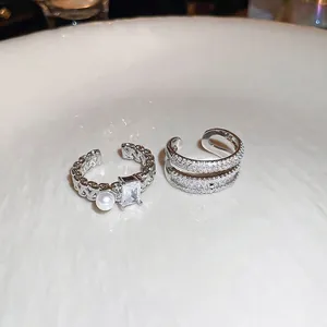 Double layered silver plated ring with square zircon and white pearl in a minimalist design