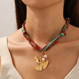 Chic gold ginkgo leaf pendant on red and green printed fabric ribbon necklace with pearls