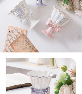Close-up of ceramic dessert cup with bow decoration and shimmering iridescent finish