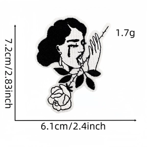 Punk style black and white embroidery patch featuring a weeping woman face and rose design