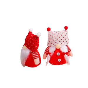 Set of two red and white knitted Christmas gnomes with polka dot hats and plush details