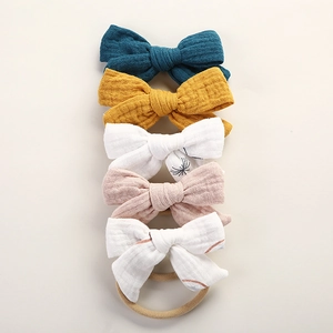 Set of 5 muslin cotton bow headbands for babies in assorted colors and patterns