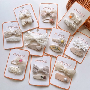 Set of 20 handmade matcha and cream hair clips with floral embroidery and bows