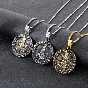 Three Viking Mjölnir pendants in silver, gold, and antique silver with Nordic runes