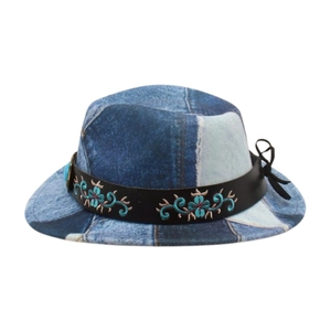 Detail of kids vintage denim hat featuring blue patchwork and floral embroidery band
