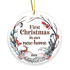 First Christmas in our new home 2023 round ceramic ornament with reindeer wreath