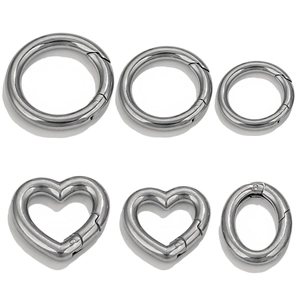 Assorted silver stainless steel spring rings in round, heart, and oval shapes