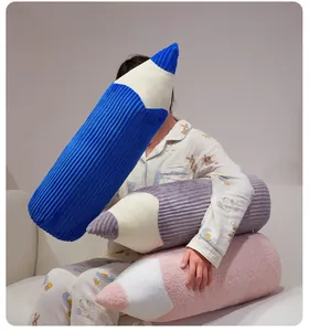 Detailed view of colorful plush pencil pillows in corduroy and fleece textures